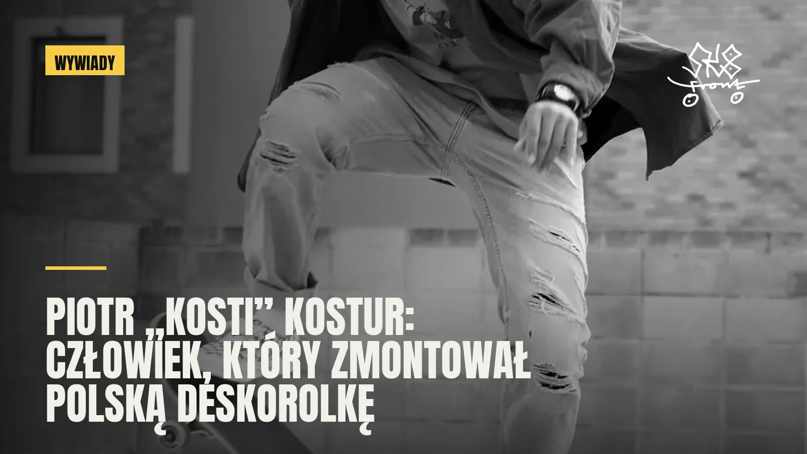 Skater w trakcie triku przy murze z cegły